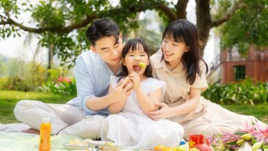 A happy family enjoying a picnic in a park.